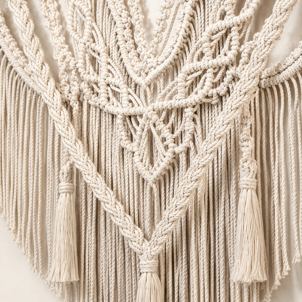 Close-up of handwoven macramé knots and tassels